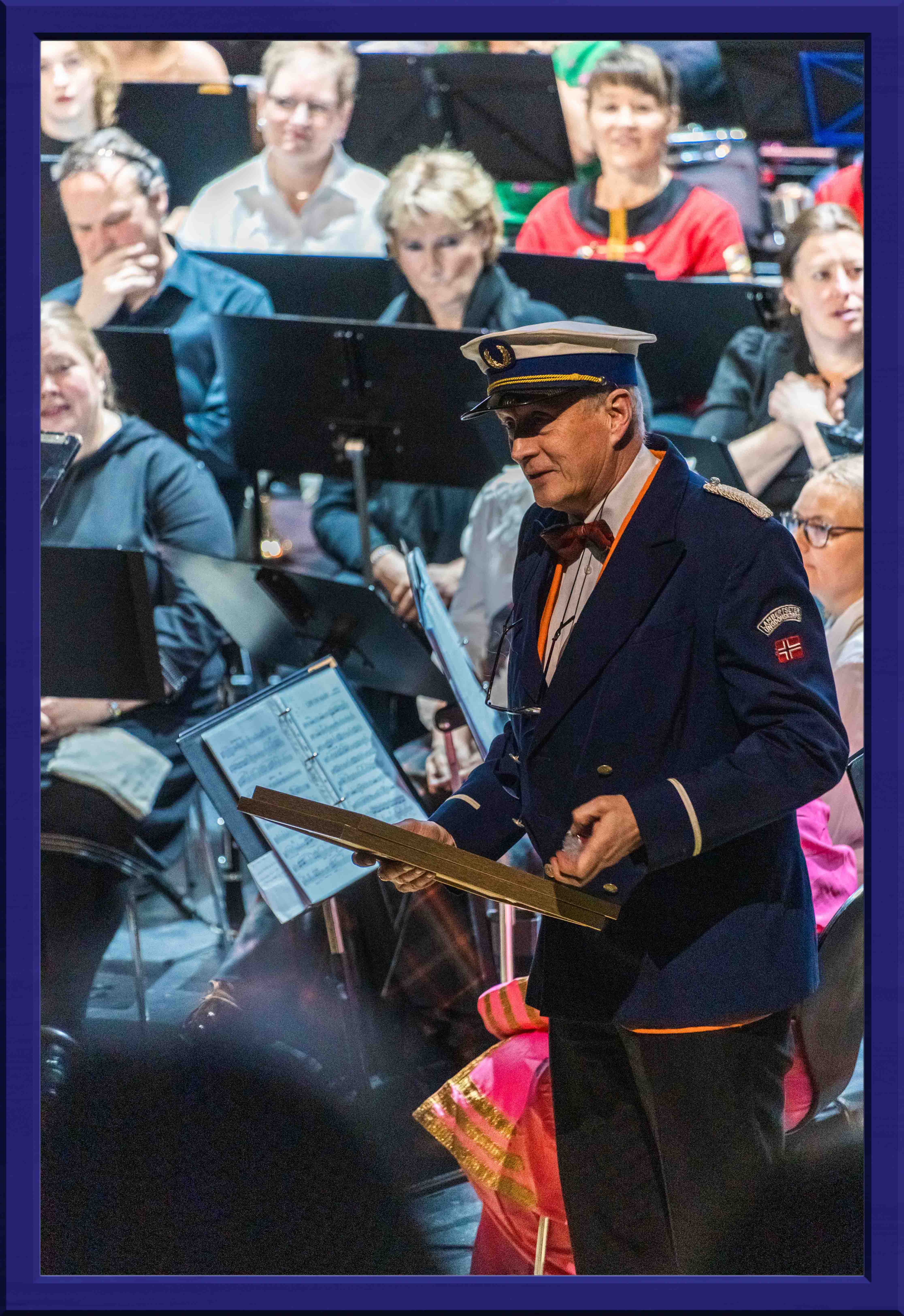 Someone dressed in a uniform talking to the crowd