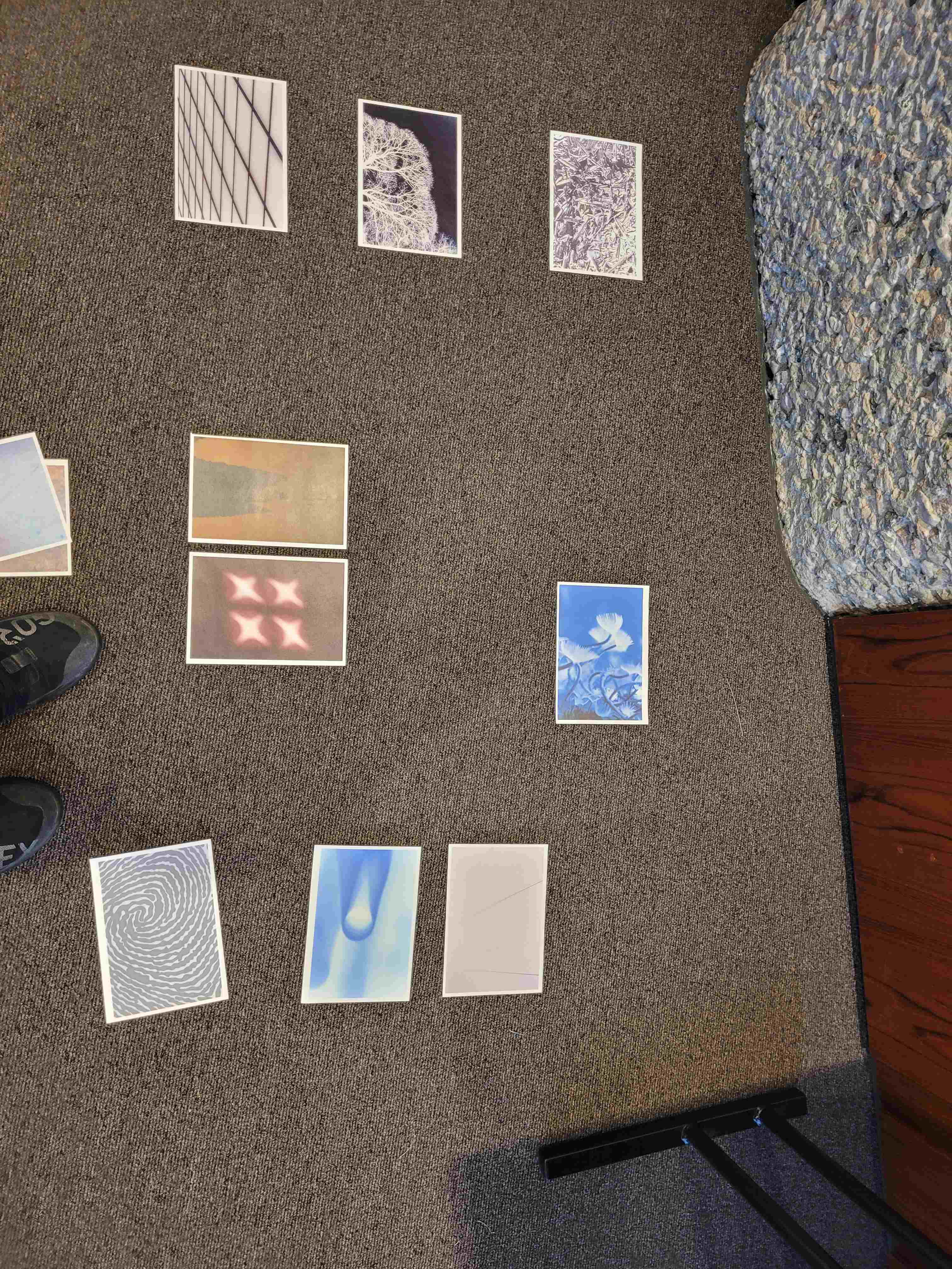 A selection of abstract photos on the floor